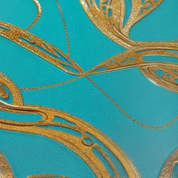 Close-up of a teal epoxy countertop with hand-poured gold ornamental detail.
